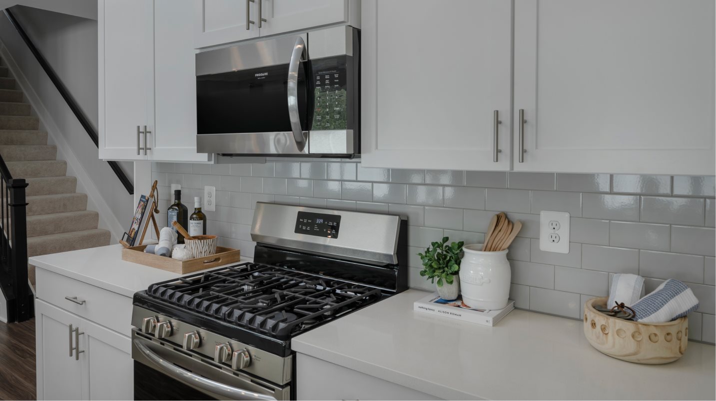 Southport Slab Kitchen Gas Stove top, micorwave, and cabinets