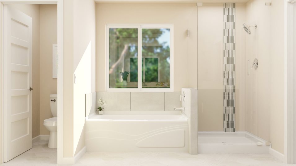 Private commode, tub, and shower in the owner's suite bathroom