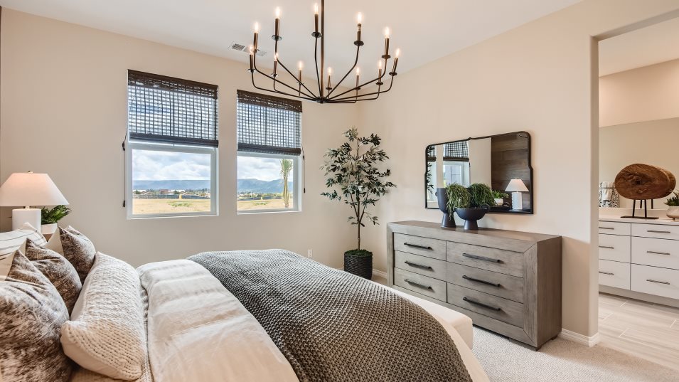 Furnished owner's suite image side of bed