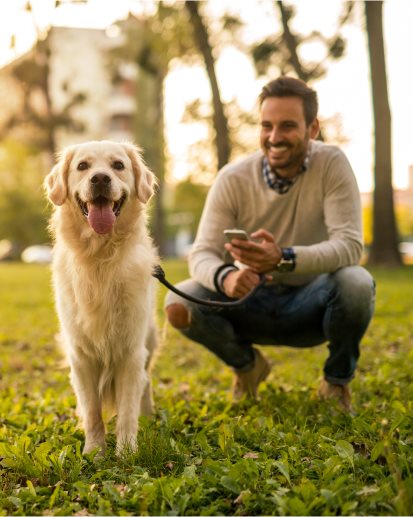 A man and a dog in a park