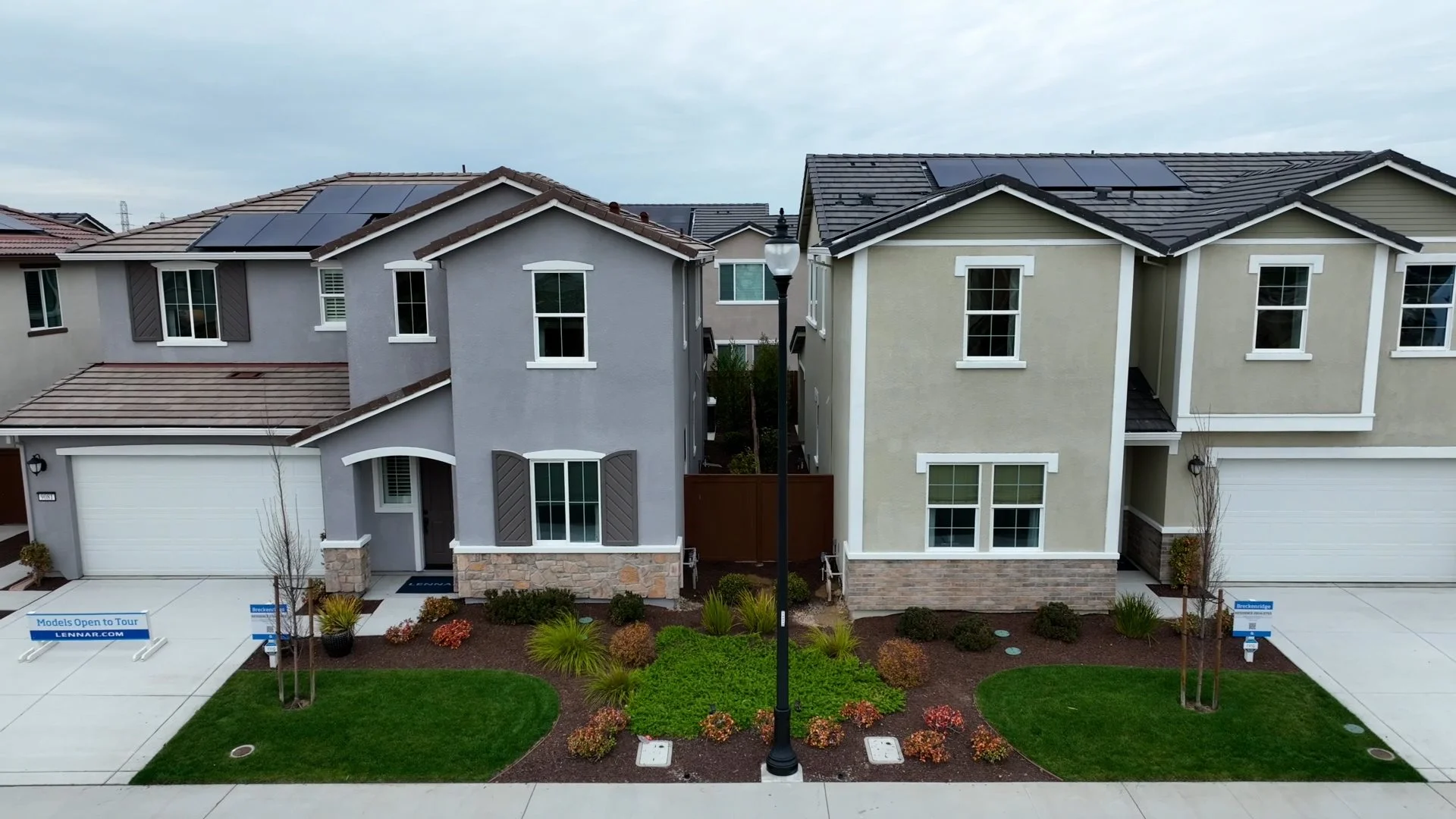 Still from the video. It shows two homes in the community