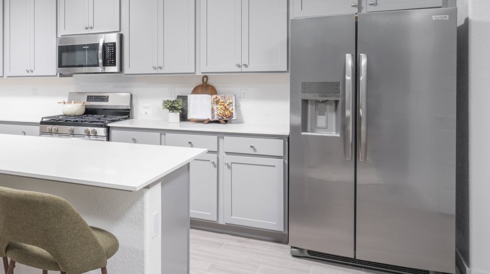 Stainless steel side-by-side refrigerator with water and ice dispenser
