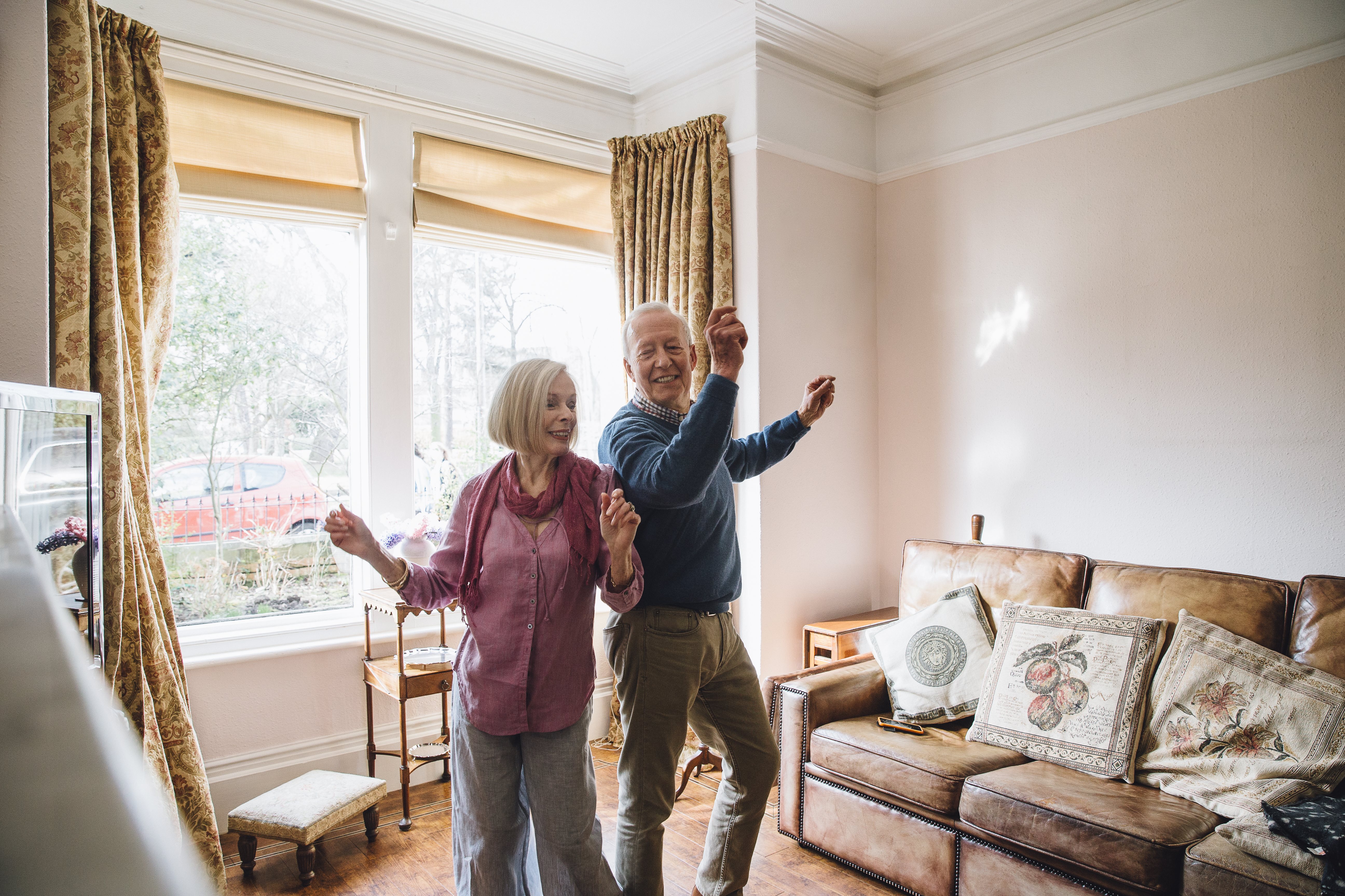 Couple dancing in the living room