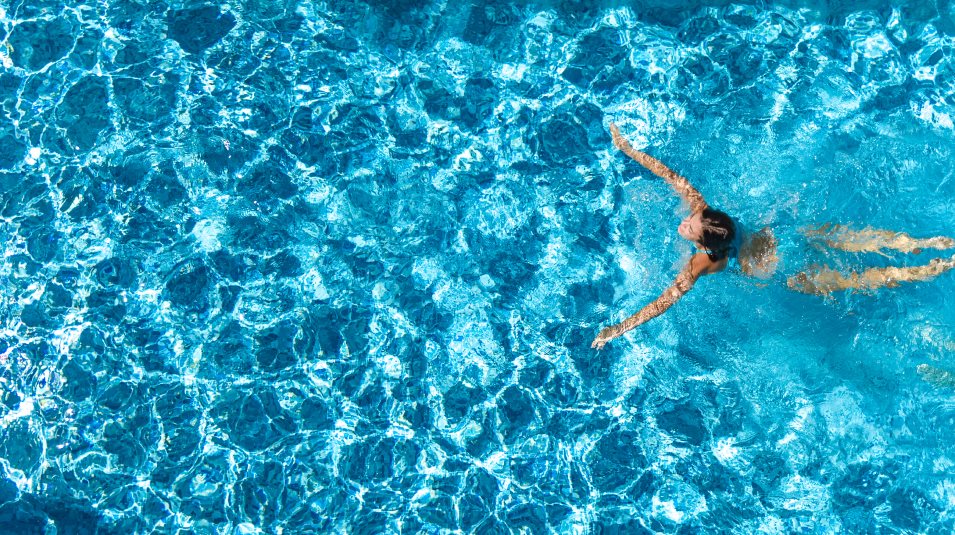 Swimming pool amenity woman swimming in pool