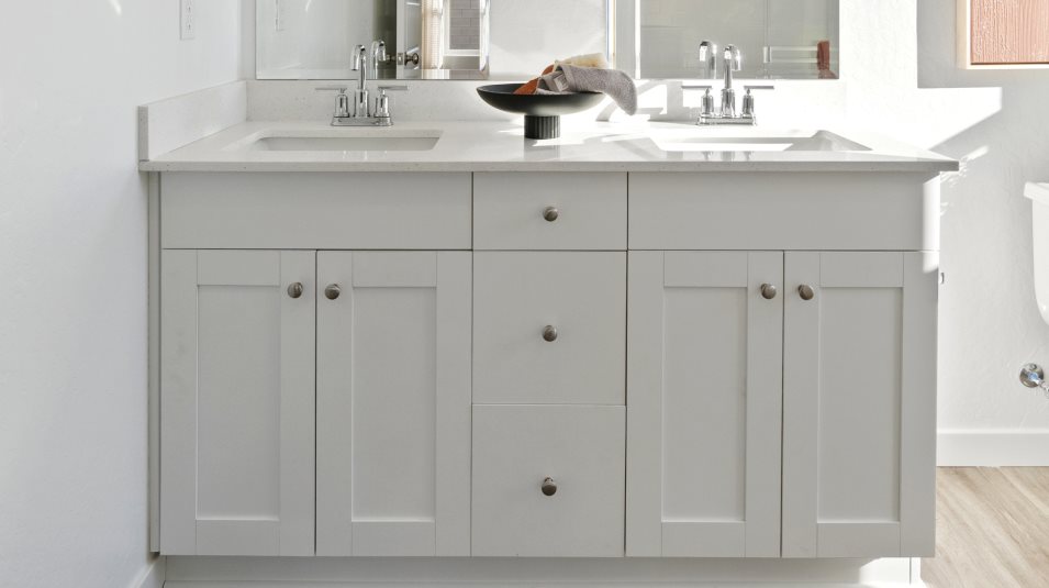 Shaker-style cabinetry in White Linen in the owner’s suite bathroom