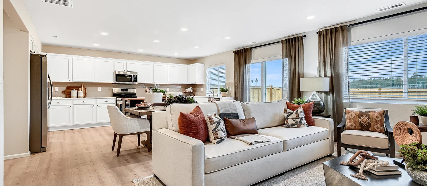 Furnished great room with kitchen visible