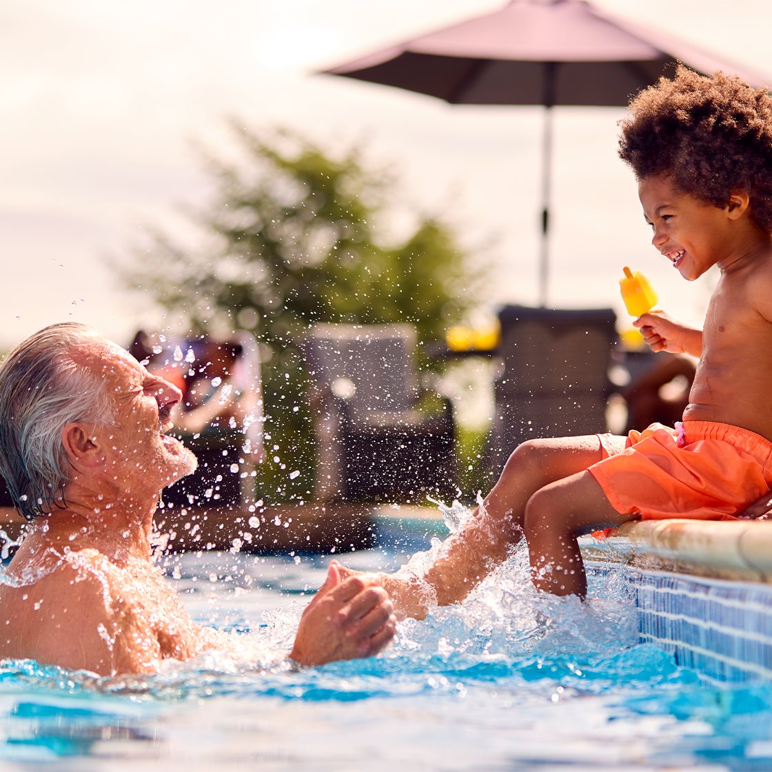 IMAGE: Child & Grandpa Swimming in Pool