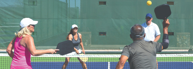 People playing pickleball