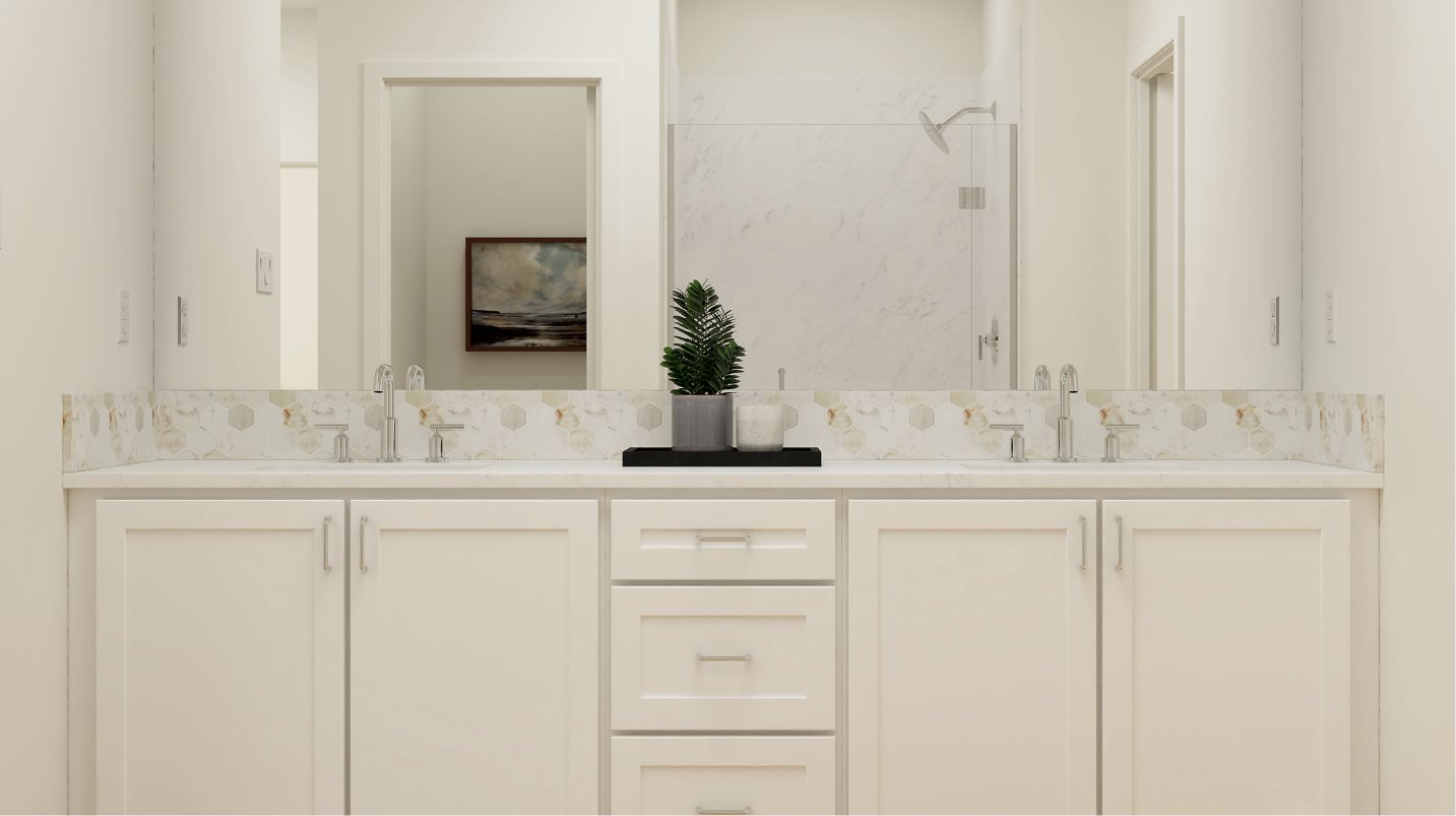 Convenient dual sinks in the owner’s suite bathroom