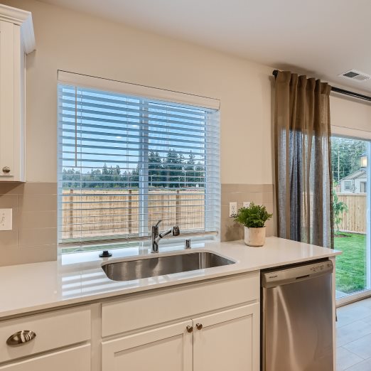Kitchen sink and view of the outdoor space
