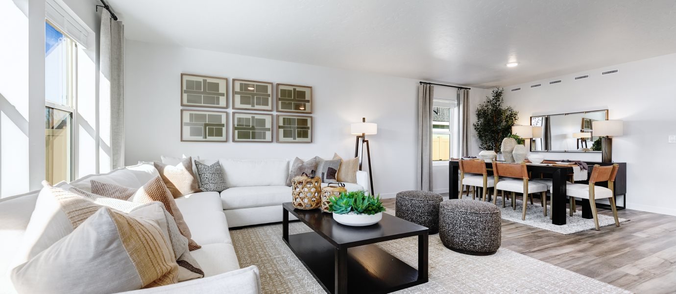 Furnished family room with the dining room visible