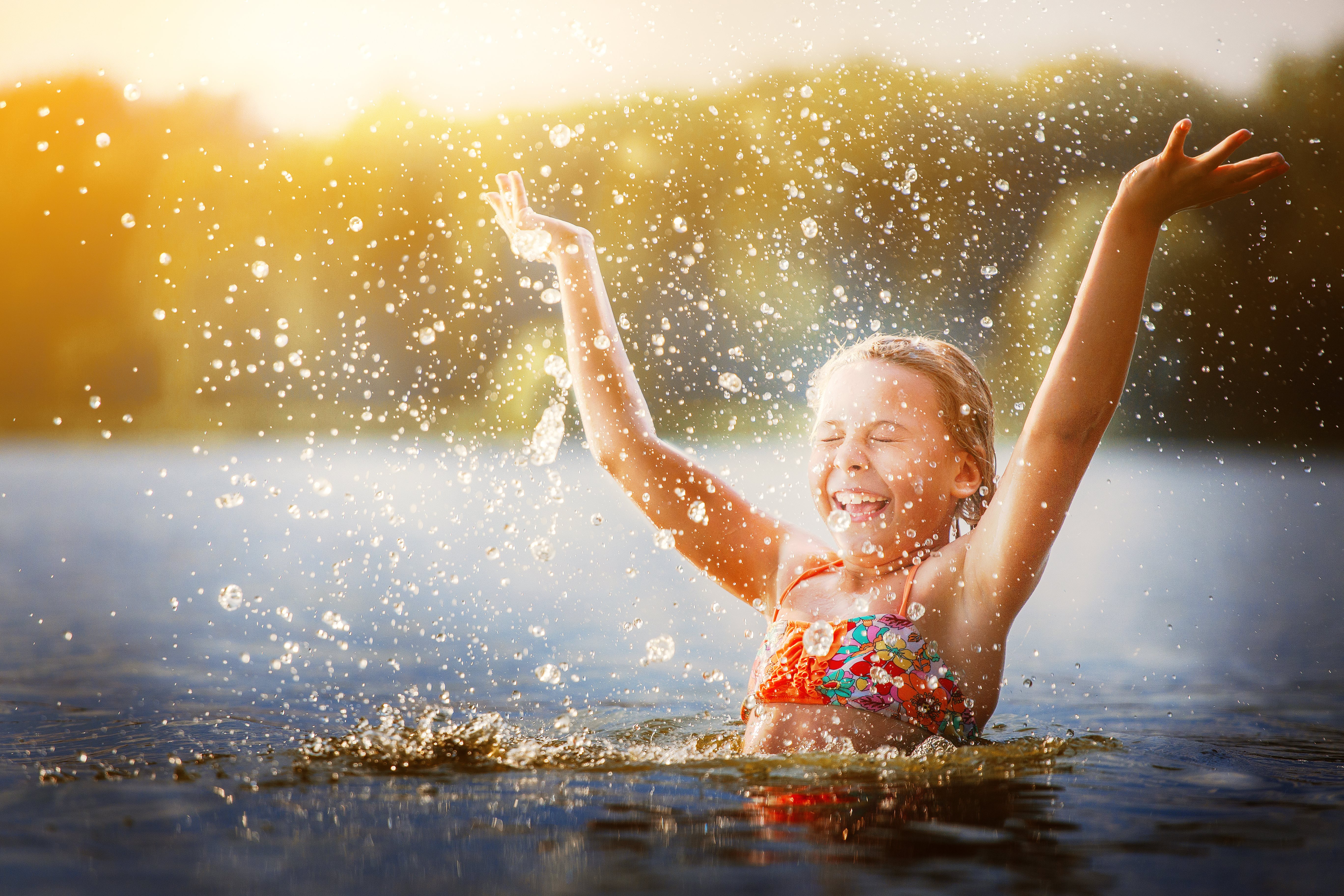 Pic Little Girl Playing in River Adobe Stock 208904875