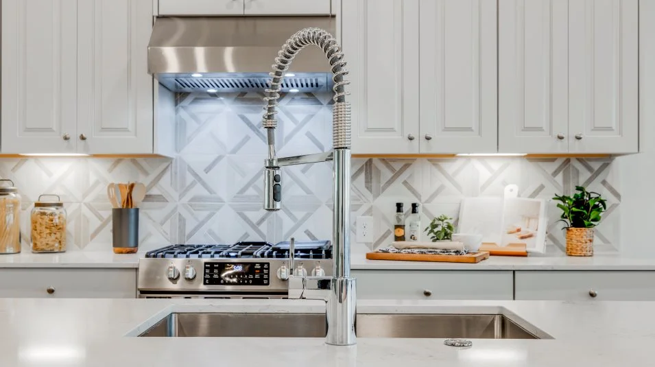 Kimball stainless steel sink with chrome faucet featuring a pull-down sprayer