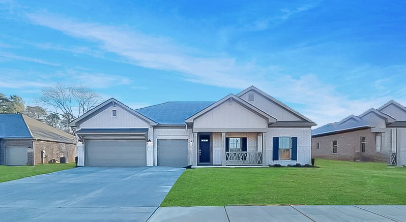 brick home exterior with 3 car garage