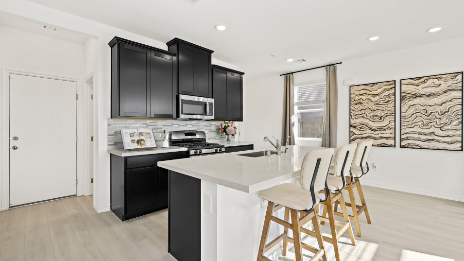 Kitchen with dark cabinets