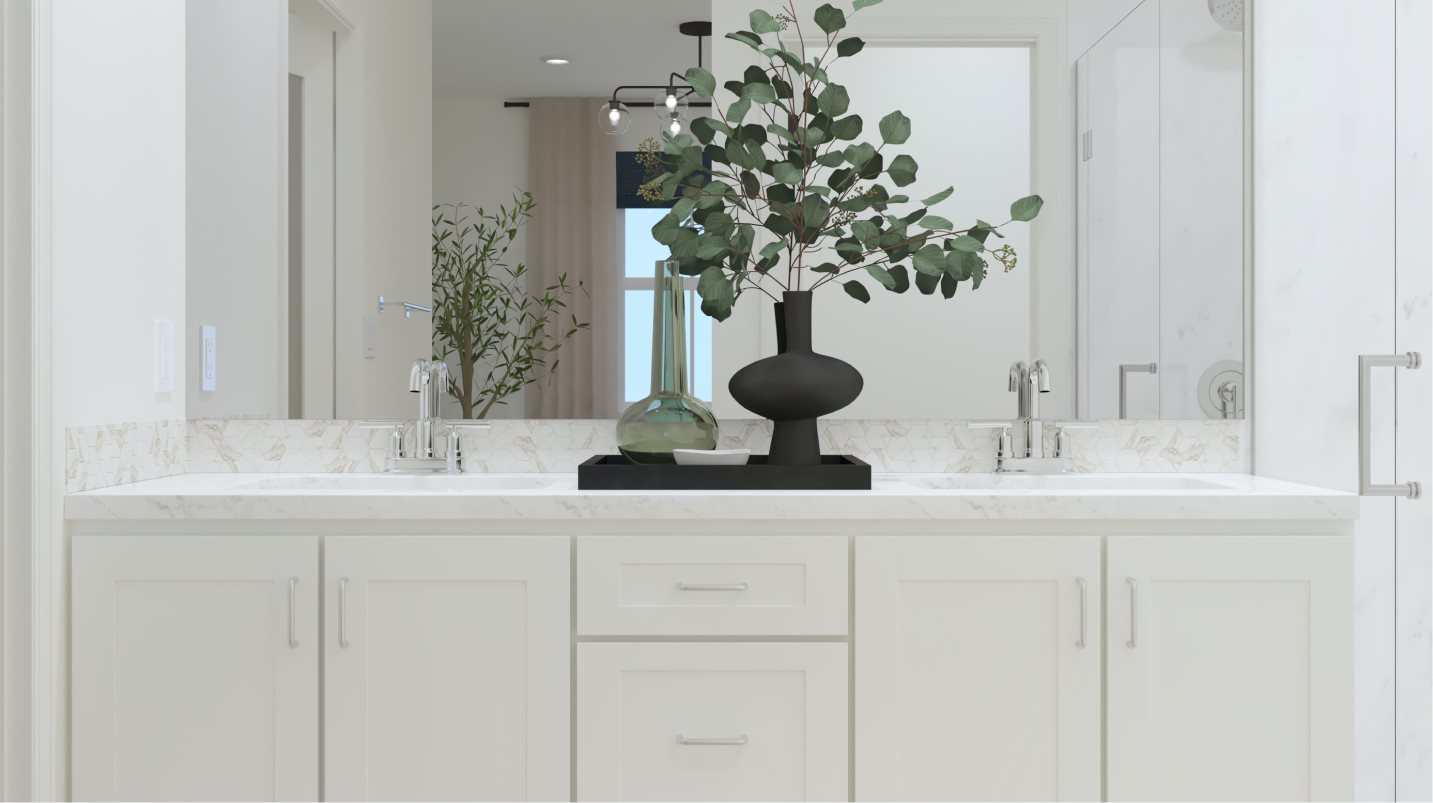 Convenient dual sinks in the owner’s suite bathroom
