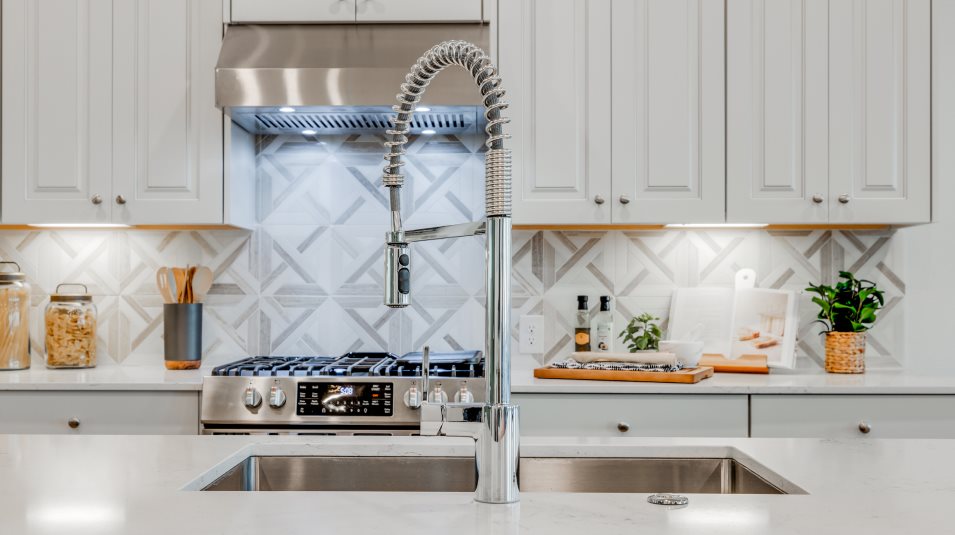 Kimball stainless steel sink with chrome faucet featuring a pull-down sprayer