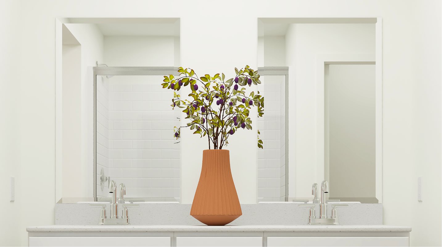 Beveled glass vanity mirrors over each sink in the owner’s suite bathroom