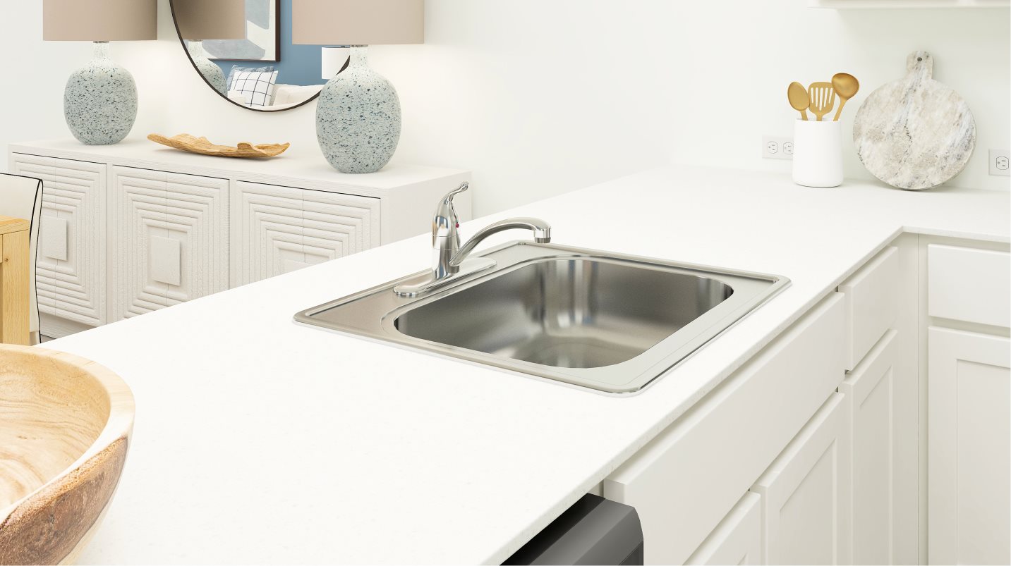 Stainless steel single-basin sink with chrome fixtures