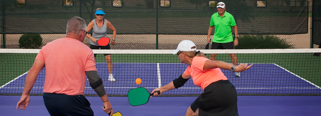 Men playing picleball