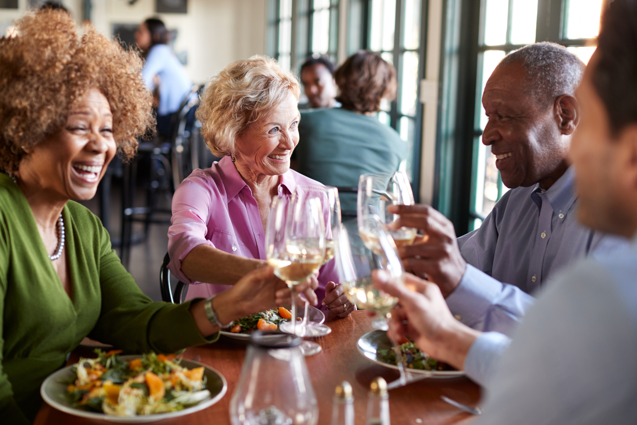 N Pic Active Adult Couples Dining Toast
