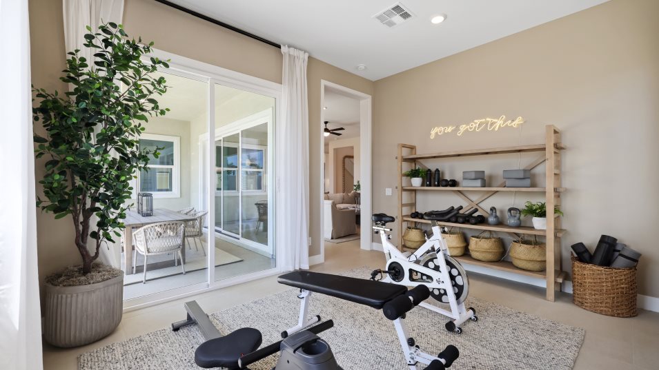 Flex room styled as a home gym with outdoor acccess