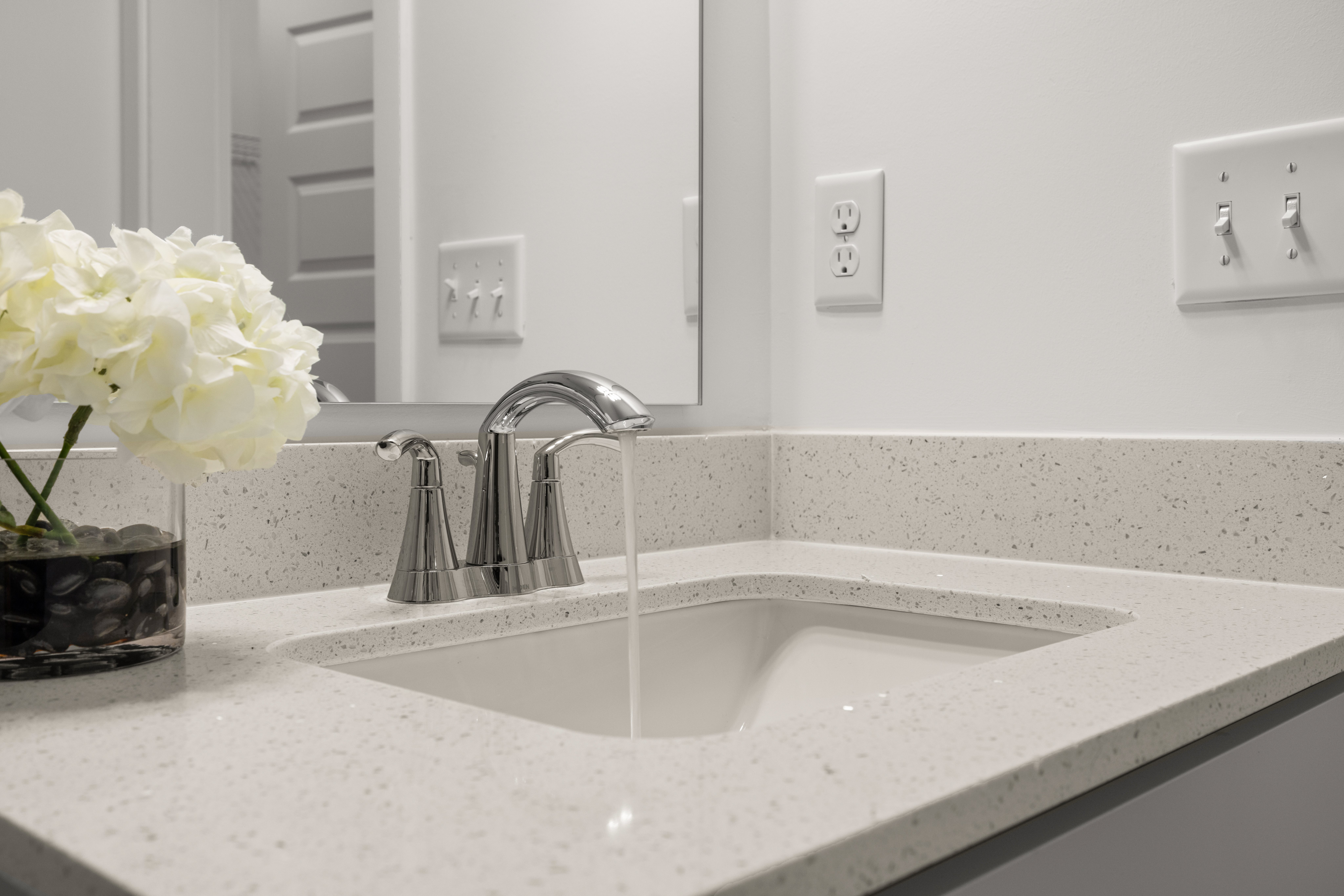 Quartz Counter Tops are featured in all kitchens and baths