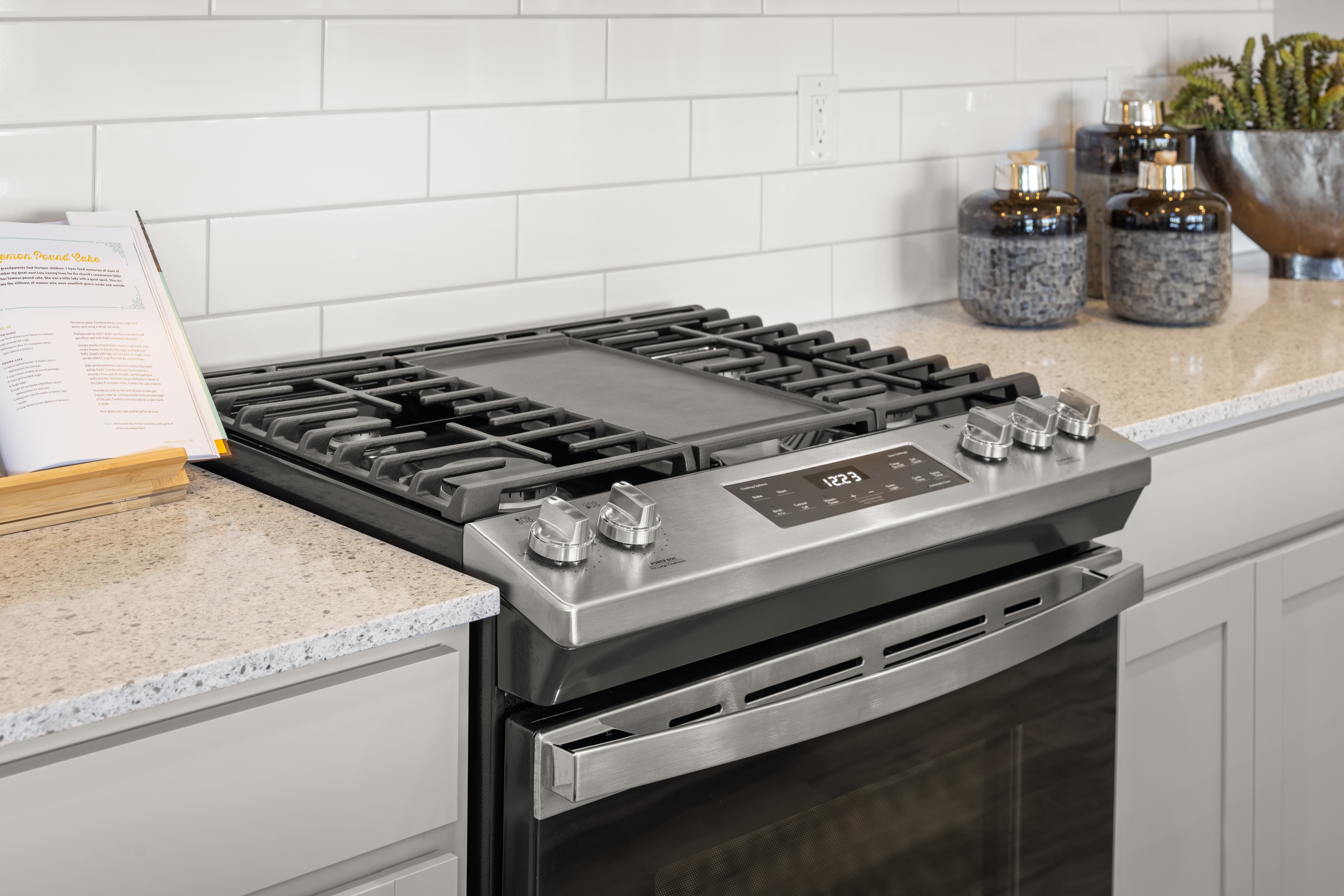 Sleek upgraded appliances including oven, refrigerator, microwave, and dishwasher