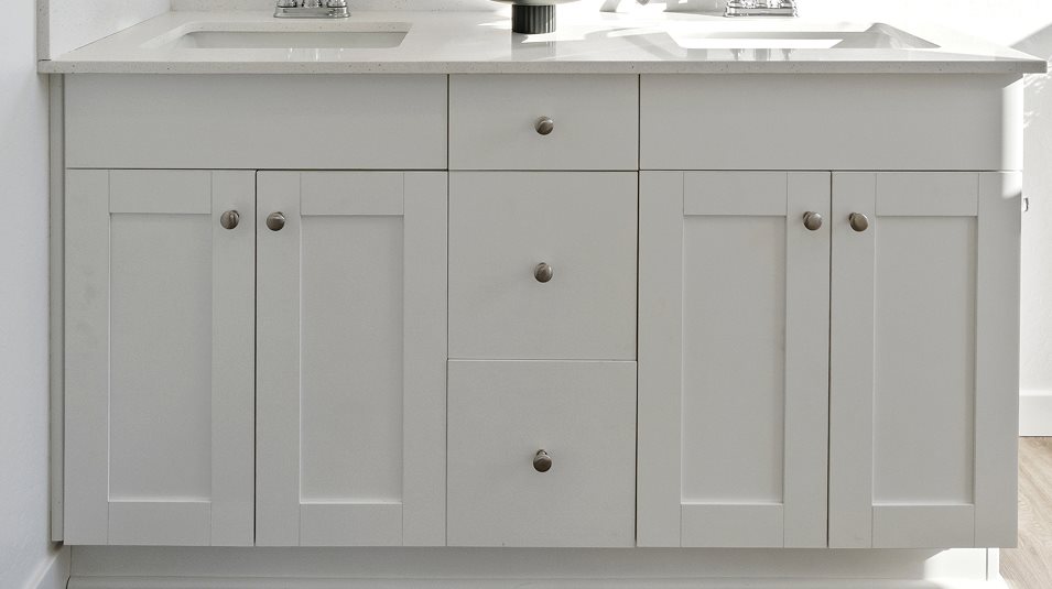 Cabinetry in White Linen in the owner’s suite bathroom
