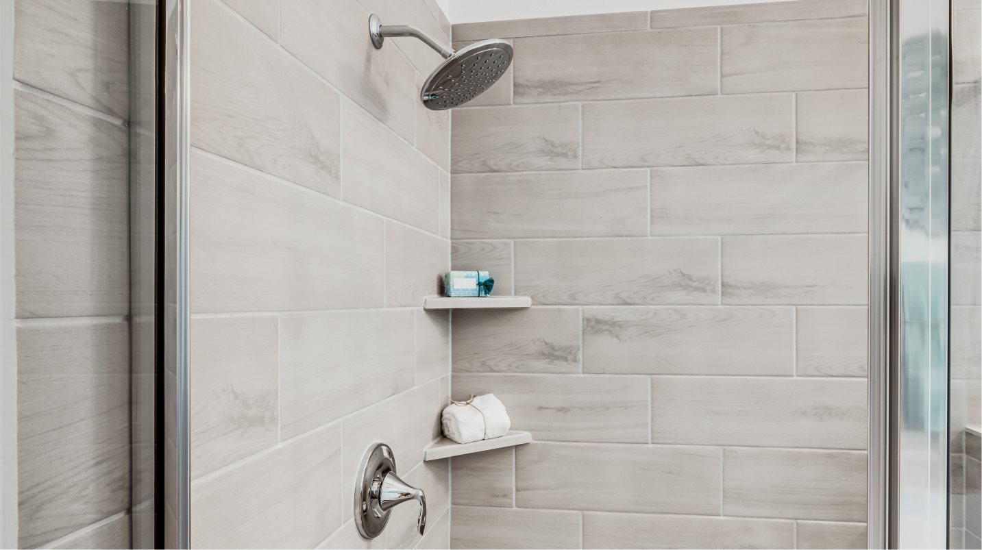 Owners Shower with glass enclosure and tile surround