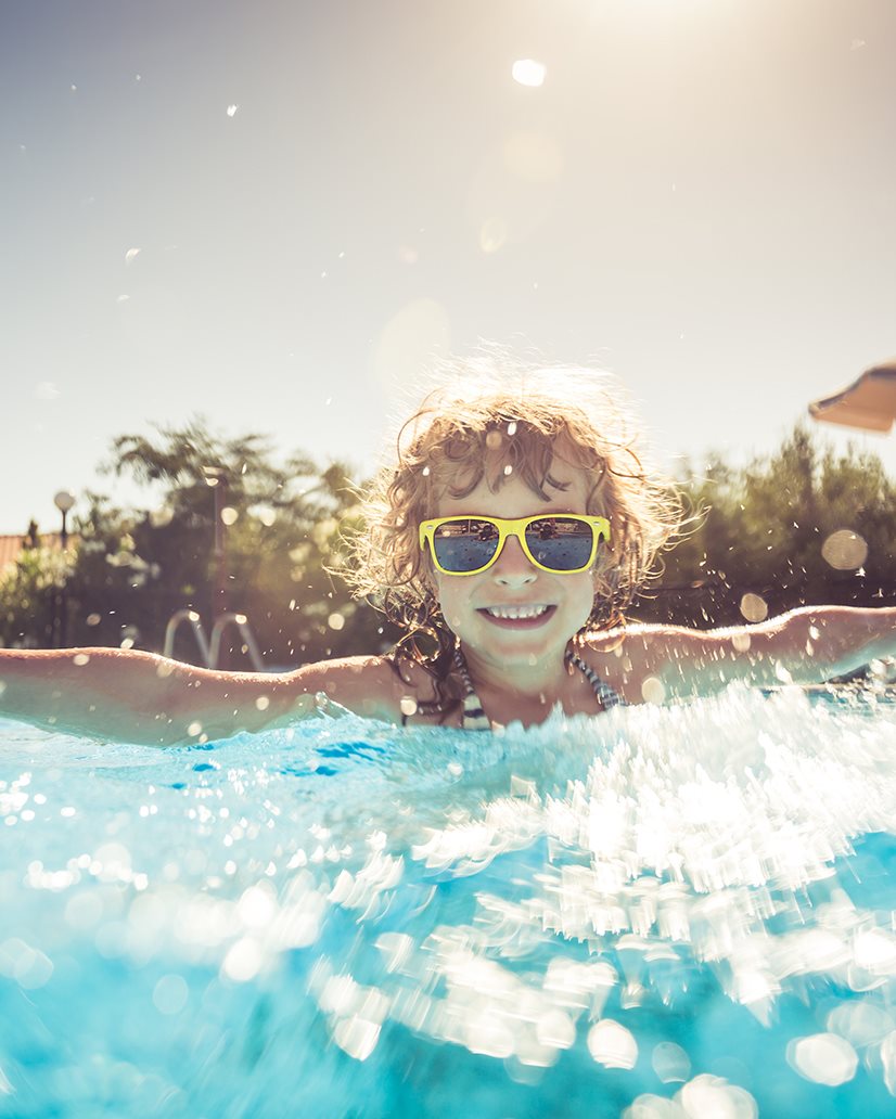 IMAGE: Child swimming in pool 