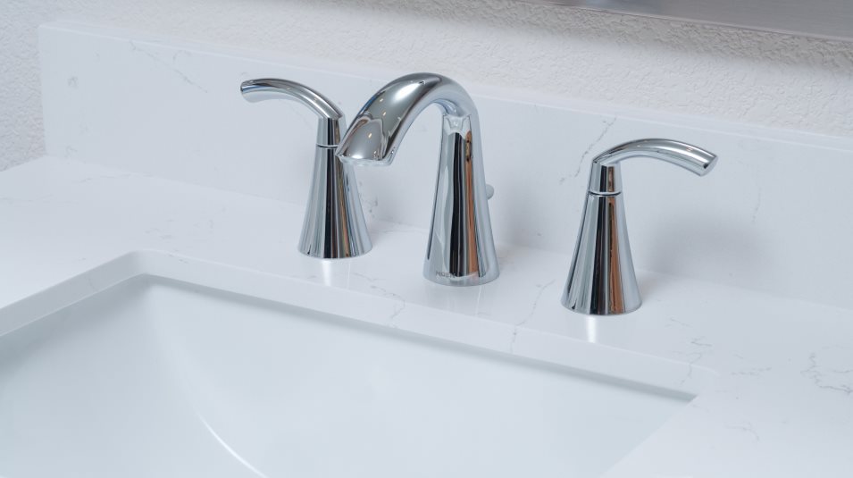 Chrome fixtures throughout bathrooms