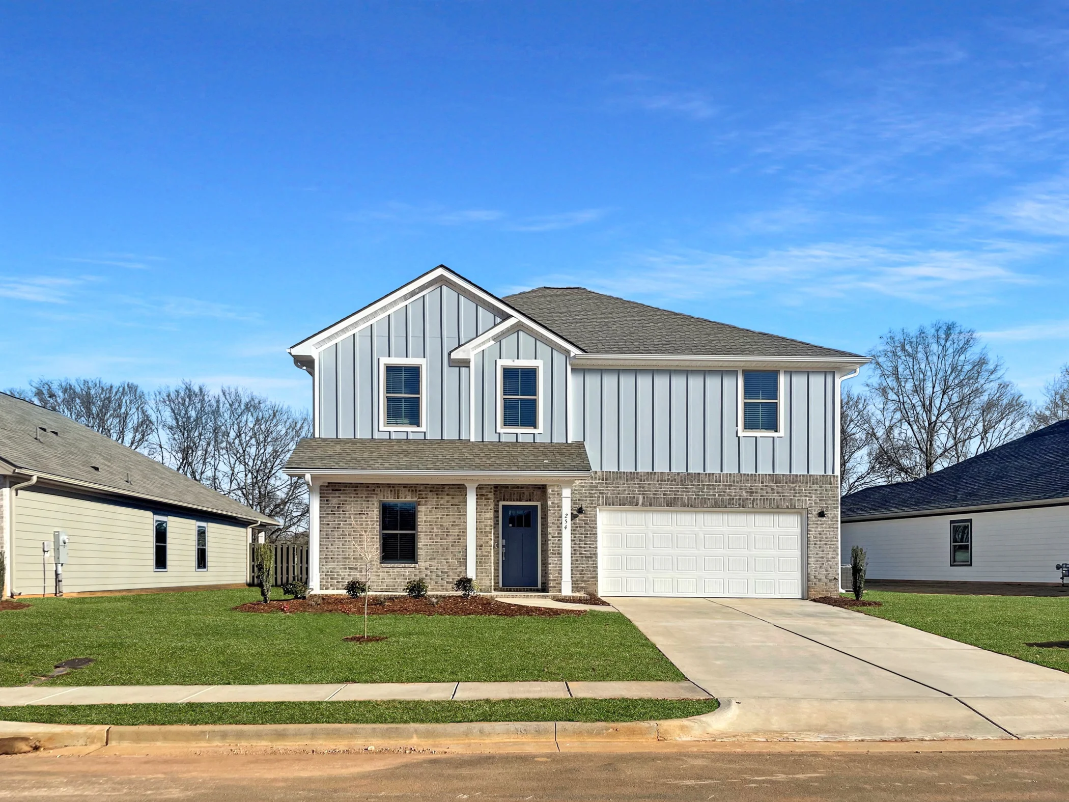 two-story home exterior with 2 car garage