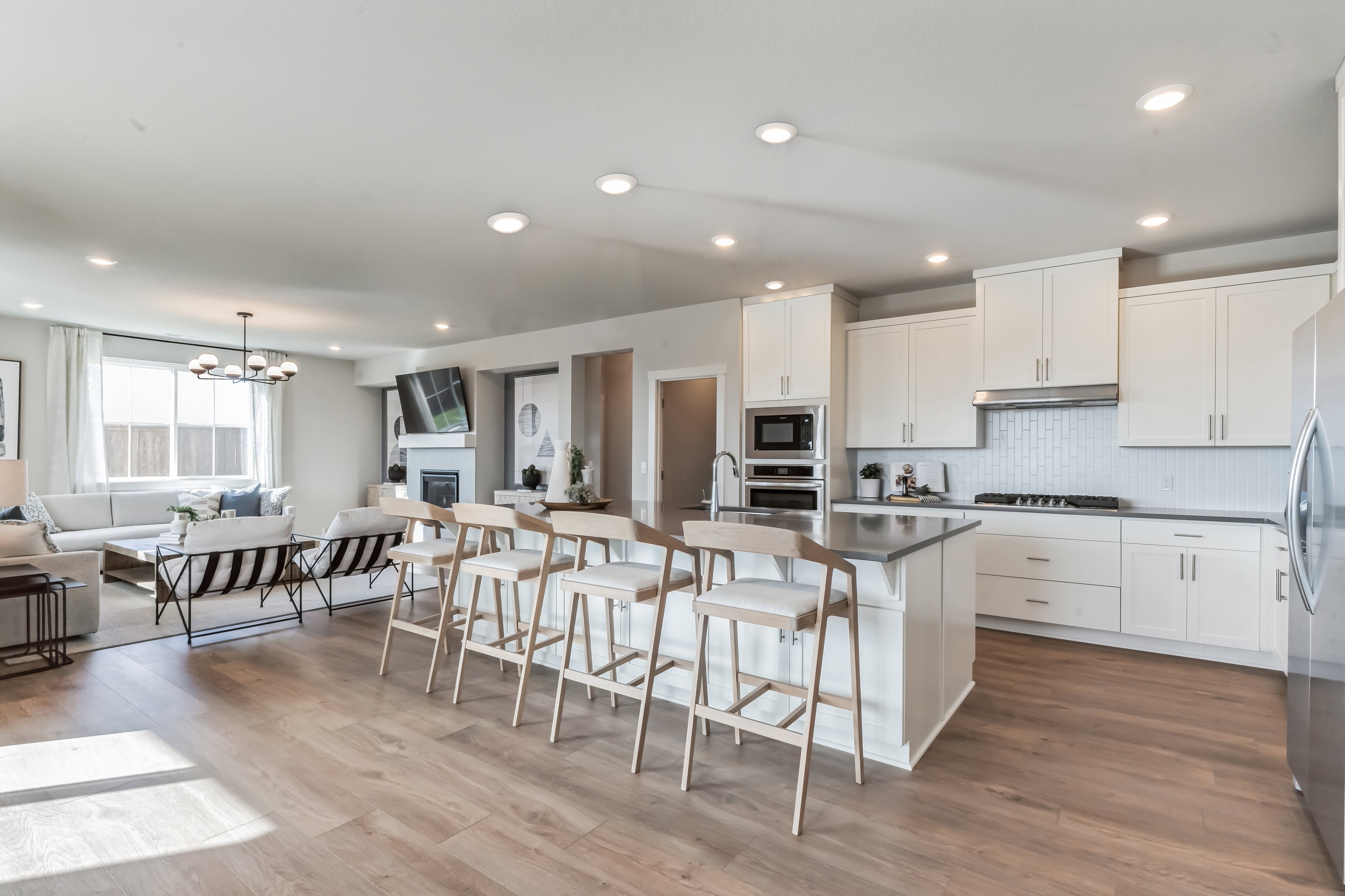 Kitchen with white cabinets and grey countertops