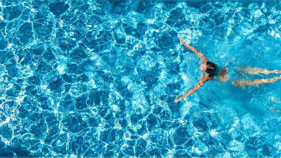 Aerial view of a woman swimming in a pool
