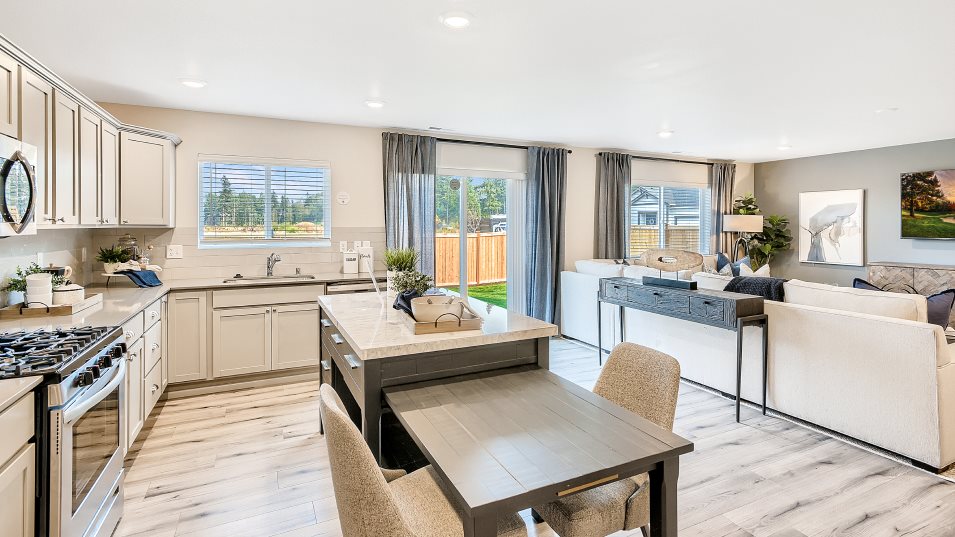 Kitchen with center island seating and access to the open space