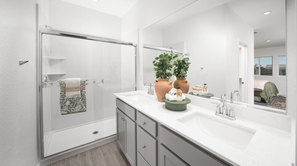 Shower with clear-glass enclosure and solid surface engineered marble surround