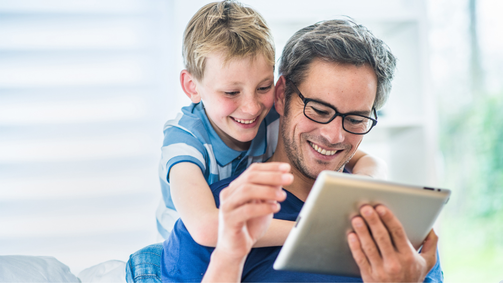 Father & Son Using Ipad